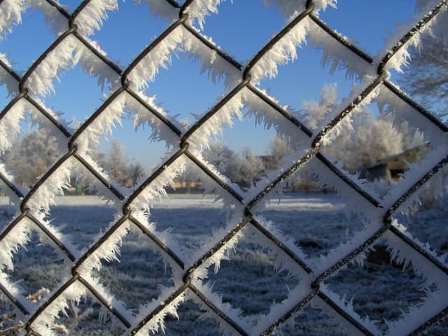 Looking through an ice covered chain link fence